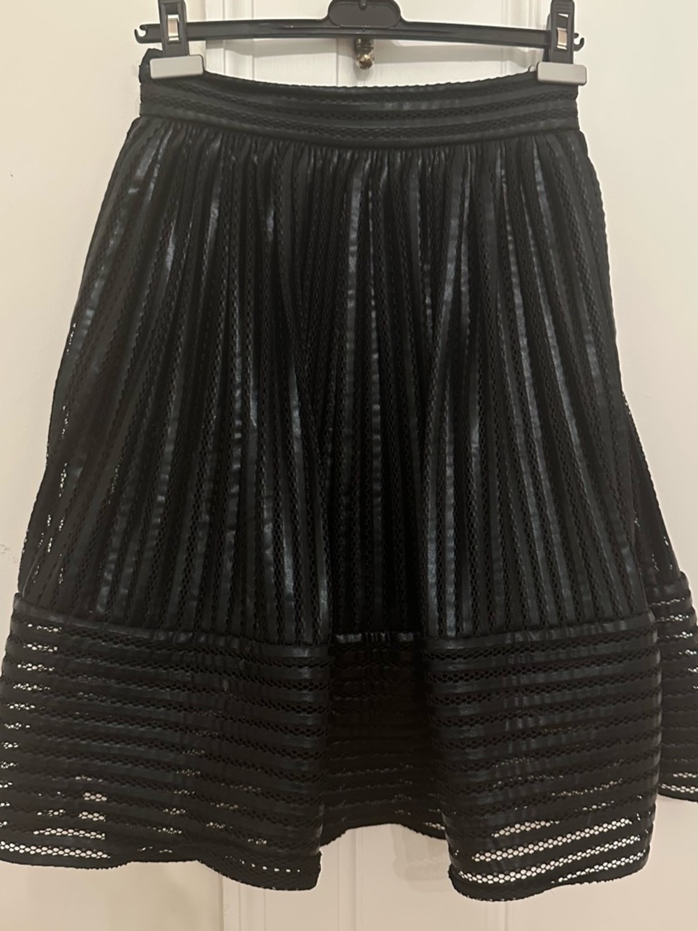 Maje Black Pleated Faux Leather Midi Skirt
Laser Cut